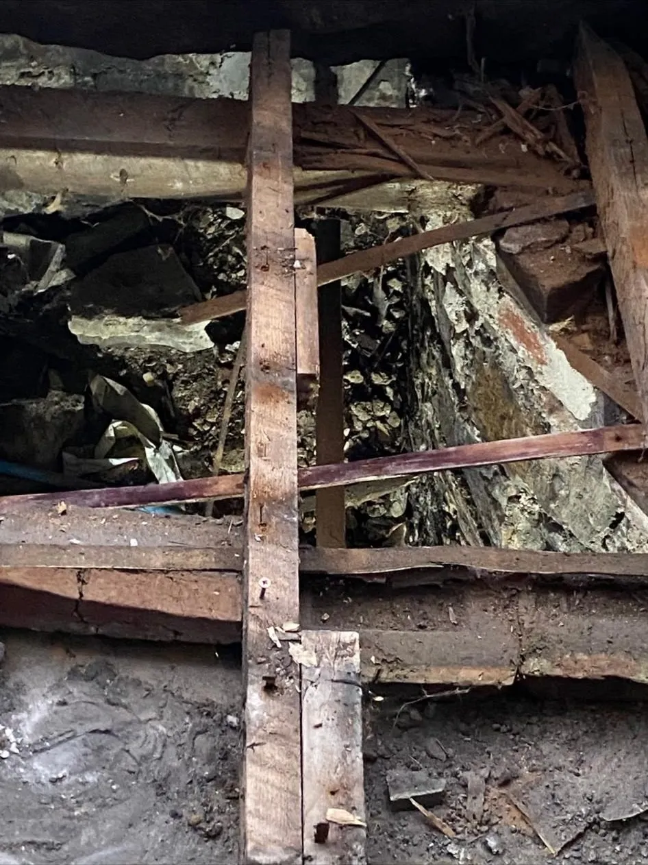 Exposed floor joists and timber structure opened up for inspection